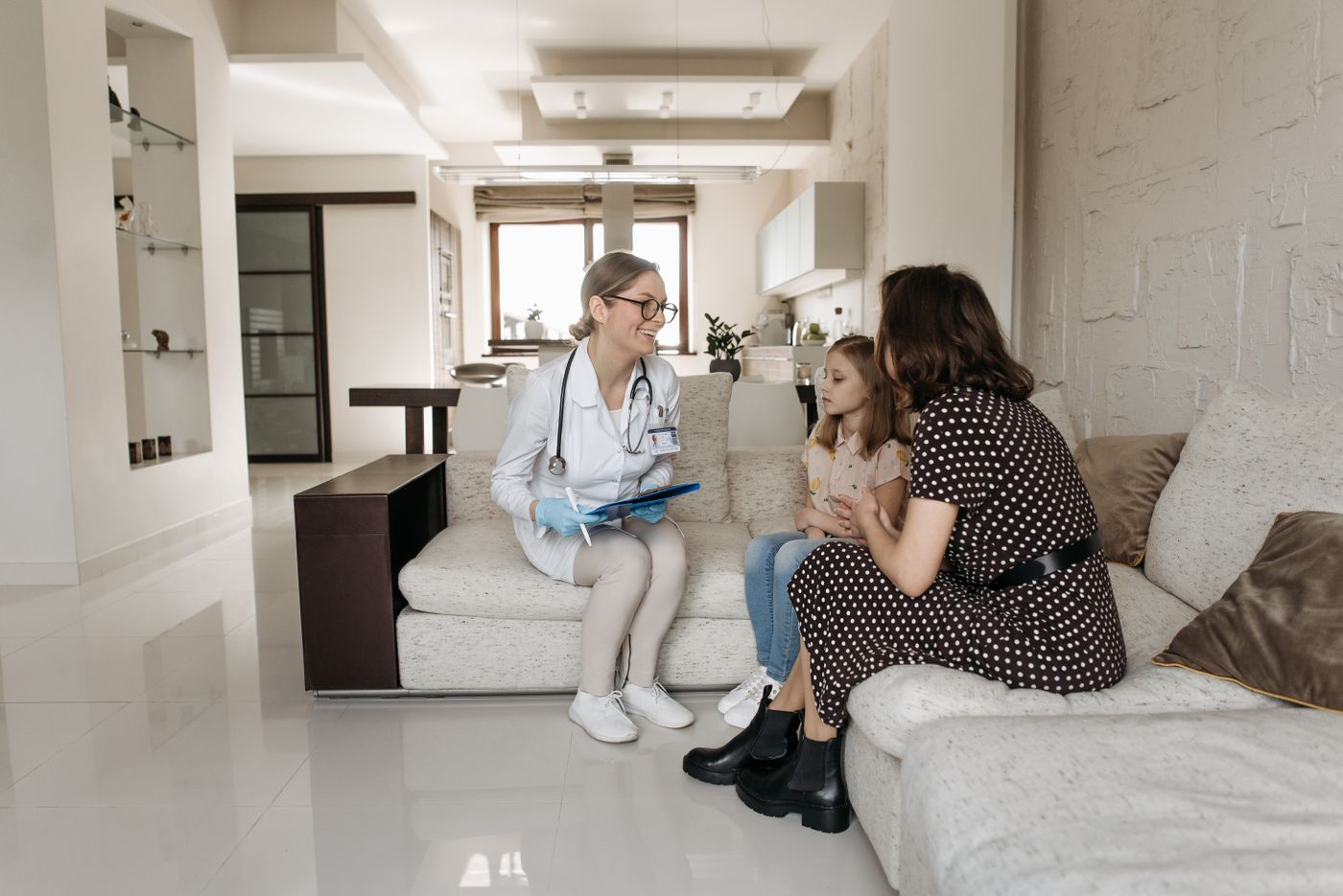 A paediatric doctor discussing a child's health with her mother
