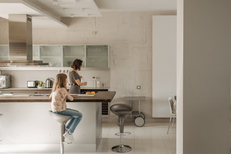 Mother And Daughter In The Kitchen