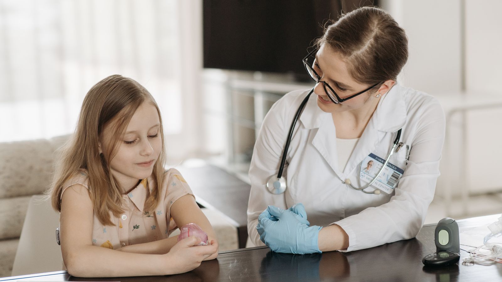 A doctor and a young girl during a pediatric check-up, fostering healthcare and trust.