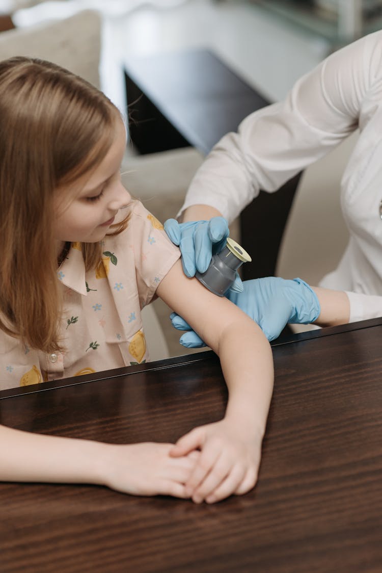 A Girl Checking Her Blood Sugar