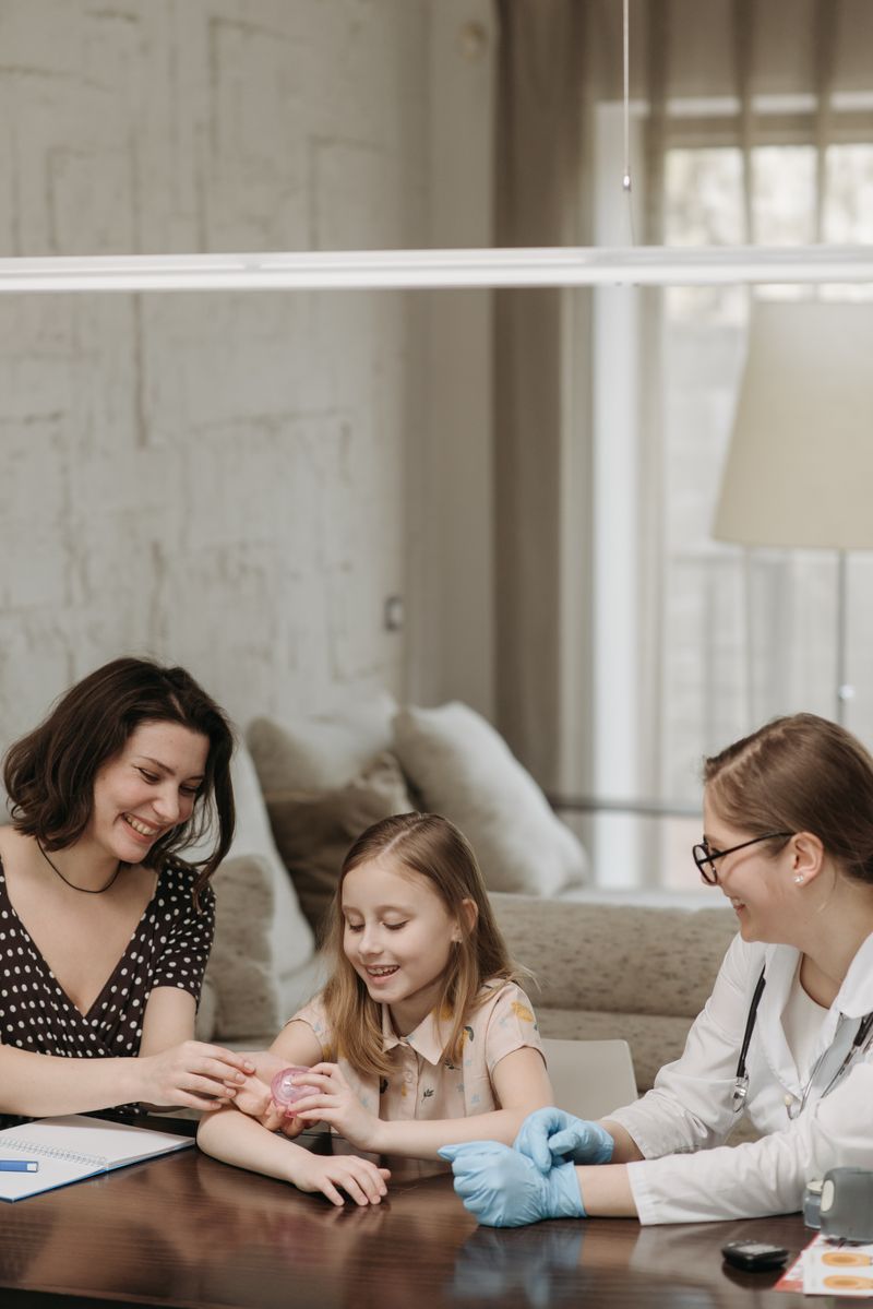 A parent and young child in a warm, caring moment — representing the pediatric telehealth relationship built on trust