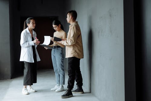 Free 
Colleagues Having a Discussion while Standing Stock Photo