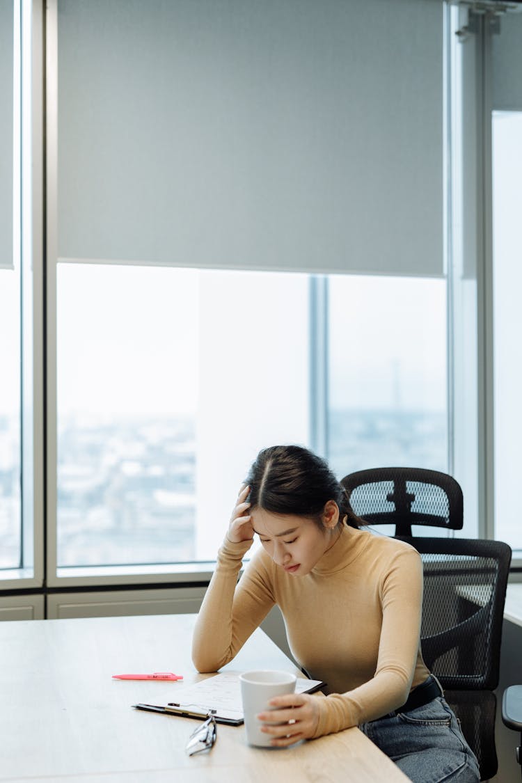 
A Woman Reading A Document