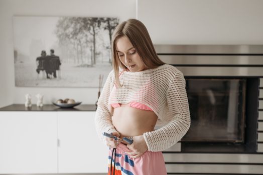 Woman in White Mesh Top and Pink Pants