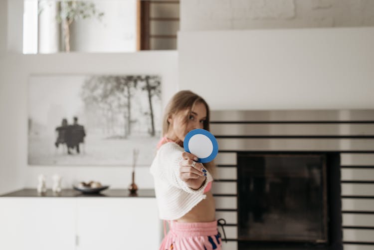 Woman Holding A Round Shape Cut Out