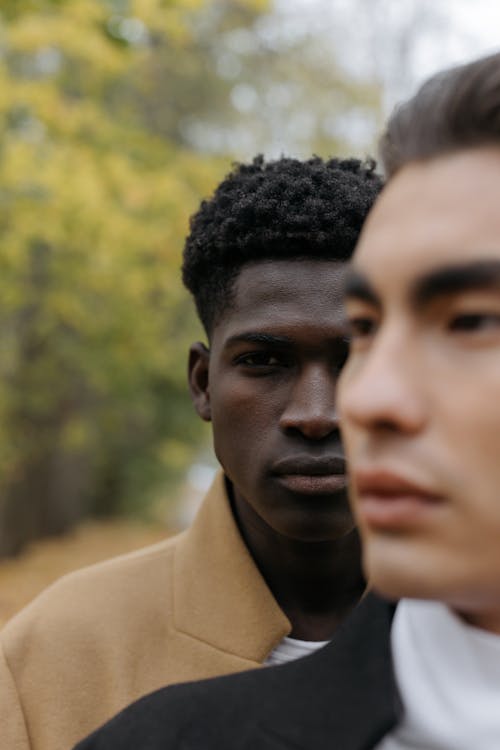 A Man in a Brown Coat Looking at the Camera