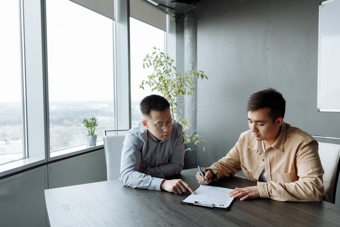 Men Sitting at the Table · Free Stock Photo
