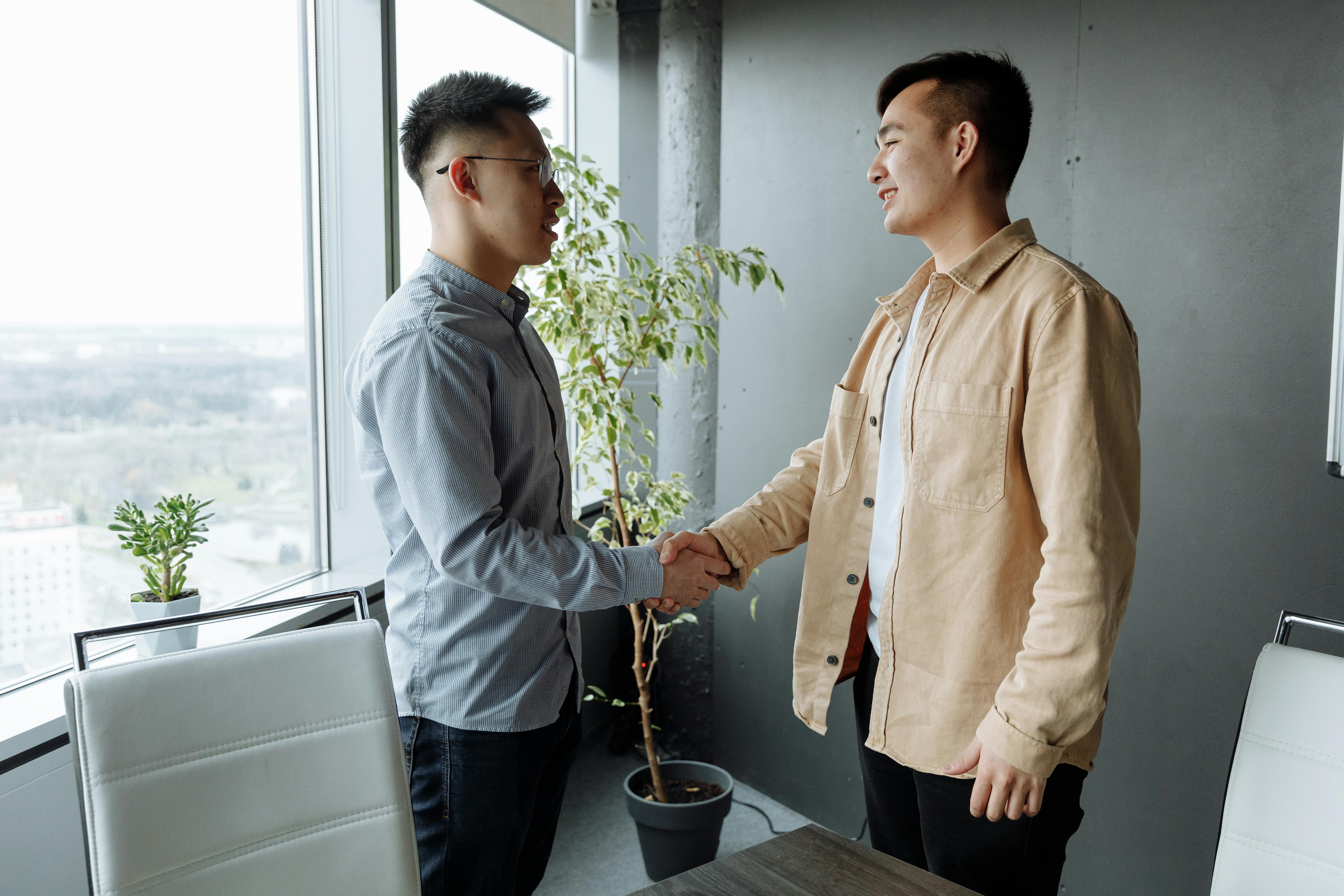 men shaking hands at the office