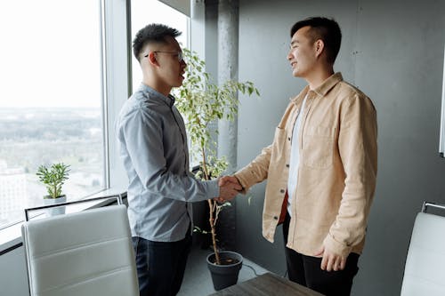 Free Men Shaking Hands at the Office Stock Photo