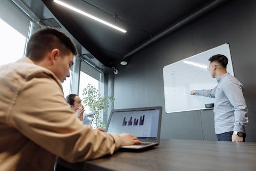 Colleagues discussing strategies in a modern conference room.