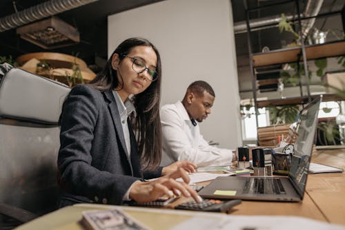 Free Man and Woman Working at the Office Stock Photo