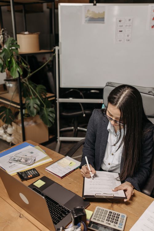 tax financial documents paperwork accountant reviewing