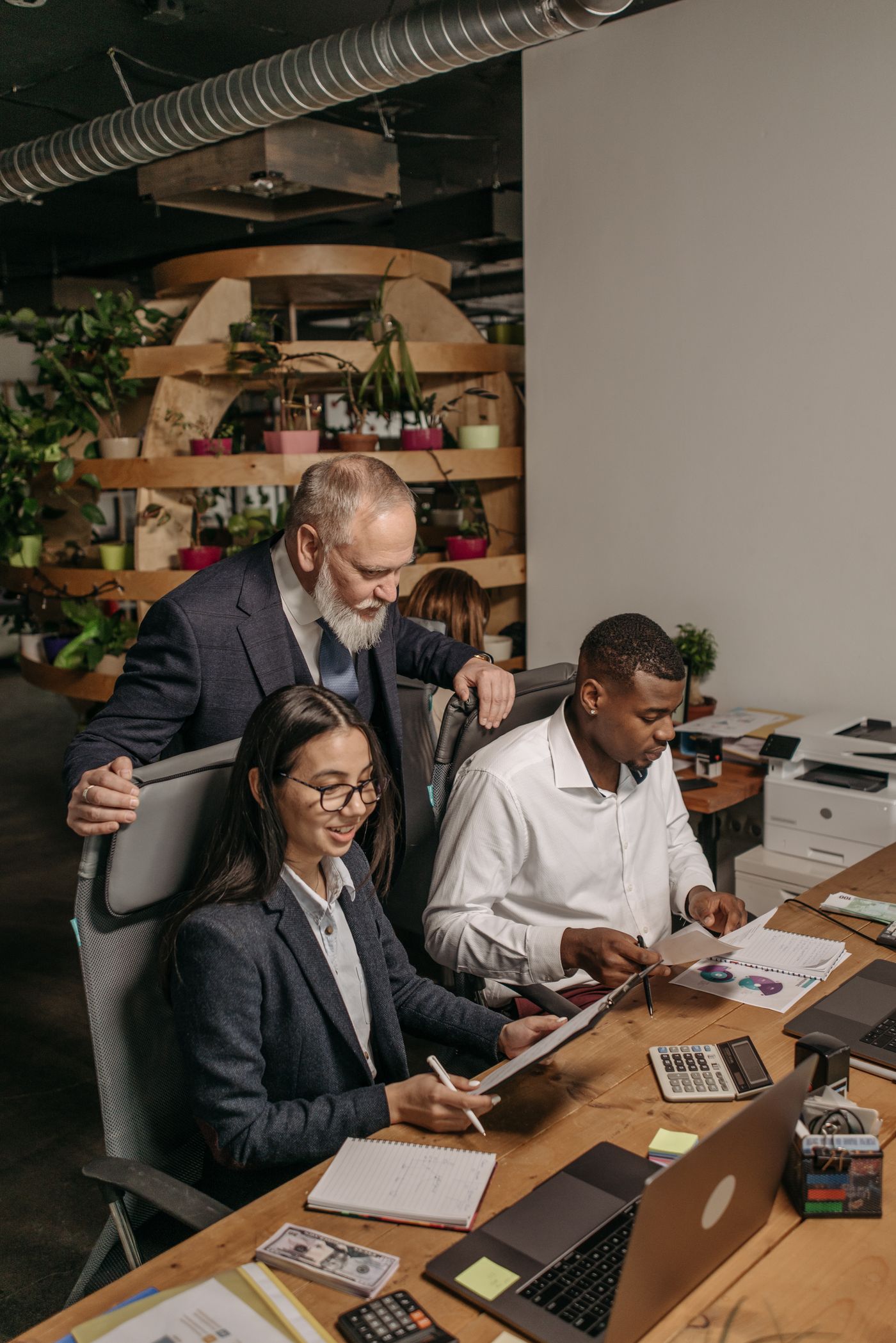 Consulting team collaborating around a table in a modern office