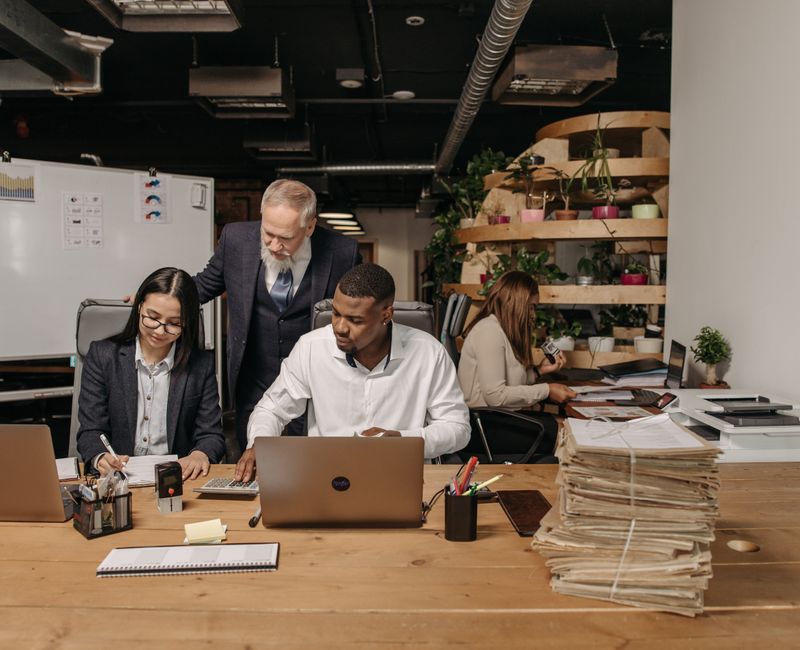 Team collaborating and automating tasks in an office setting