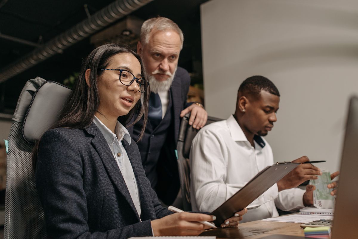 A diverse team of professionals collaborating in a modern office, representing the global workforce