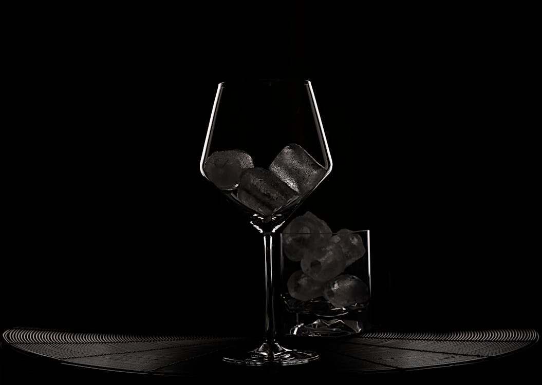 Premium Photo  Frozen wine glass on black surface