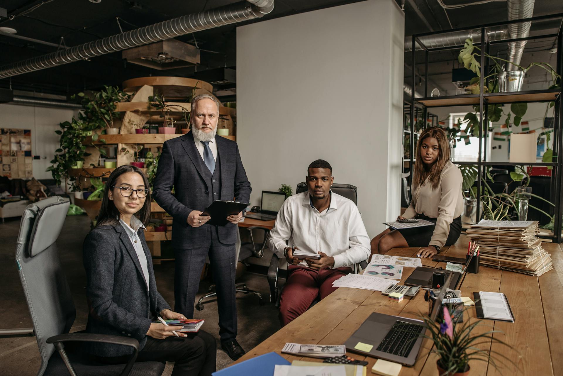 A diverse group of professionals working together in an innovative office environment.