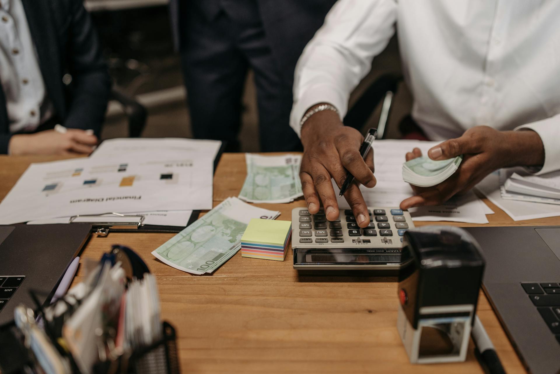 Close-Up Shot of a Person Holding Paper Money