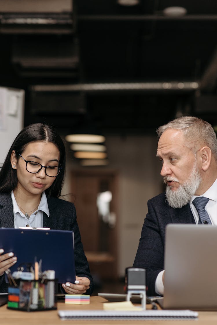 A Woman Reporting To Her Boss