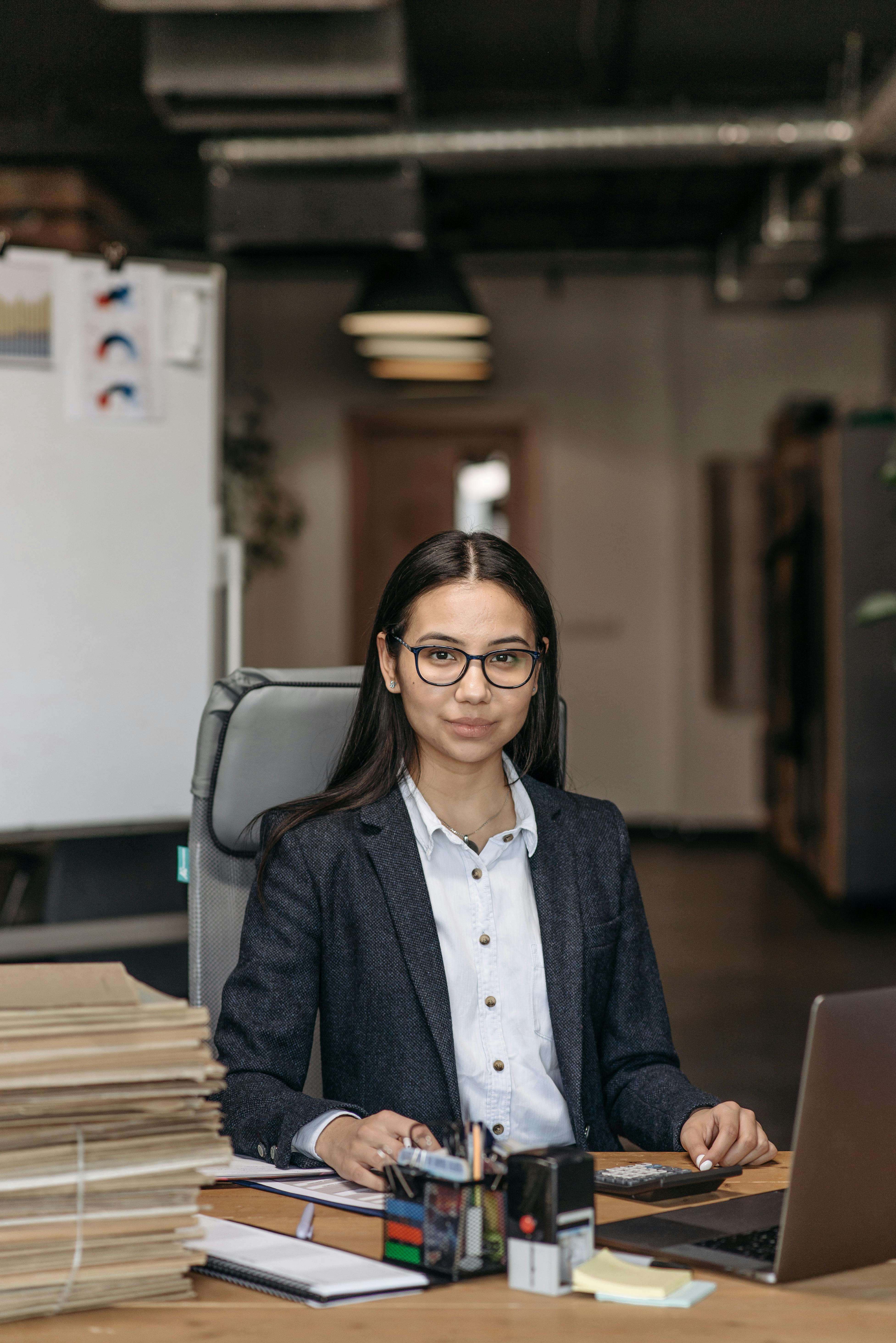 a businesswoman sitting at her work desk