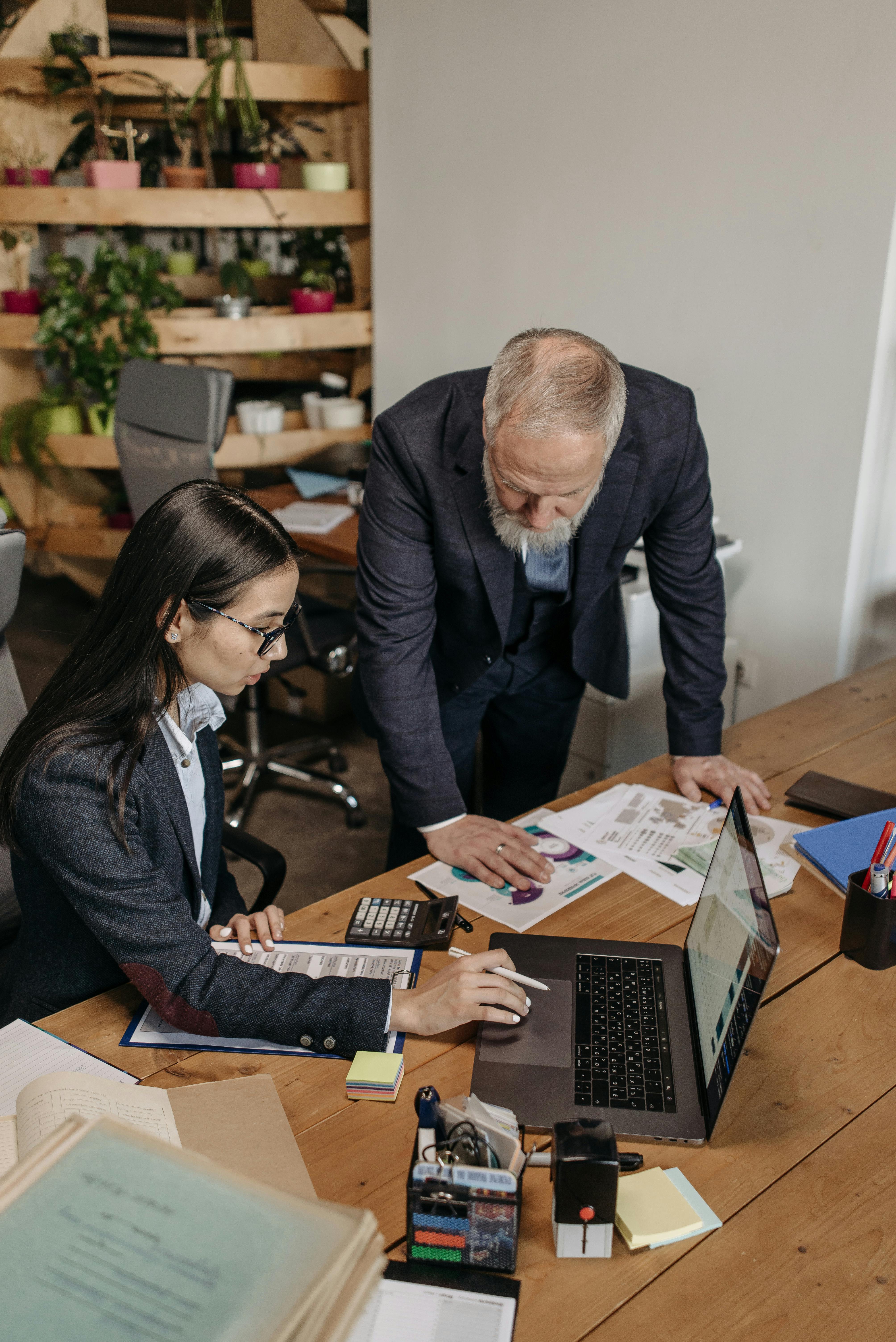 man and woman working in the office