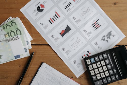Free Business Analytic and Calculator on Top of the Table Stock Photo