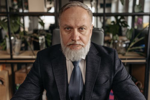 An Elderly Man in His Business Suit