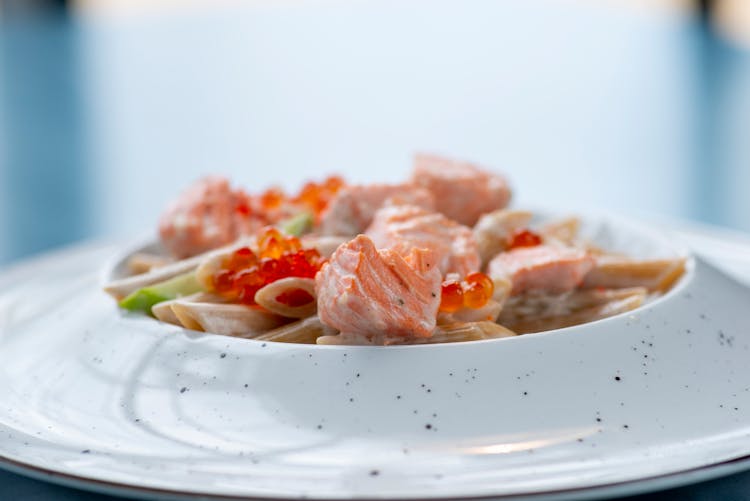 Close-up Of A Dish With Salmon In Creamy Sauce 