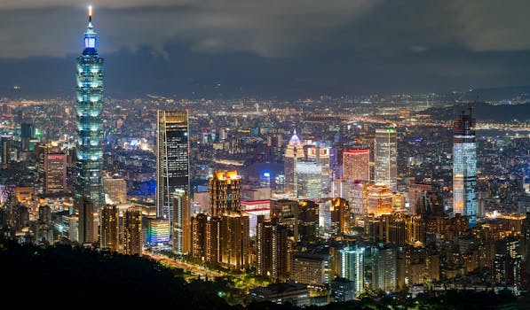 Breathtaking view of Taipei's skyline featuring the iconic Taipei 101 illuminated against the night sky.
