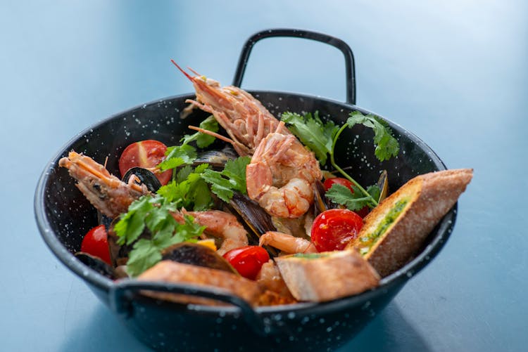 Cooked Seafood In Black Pot 