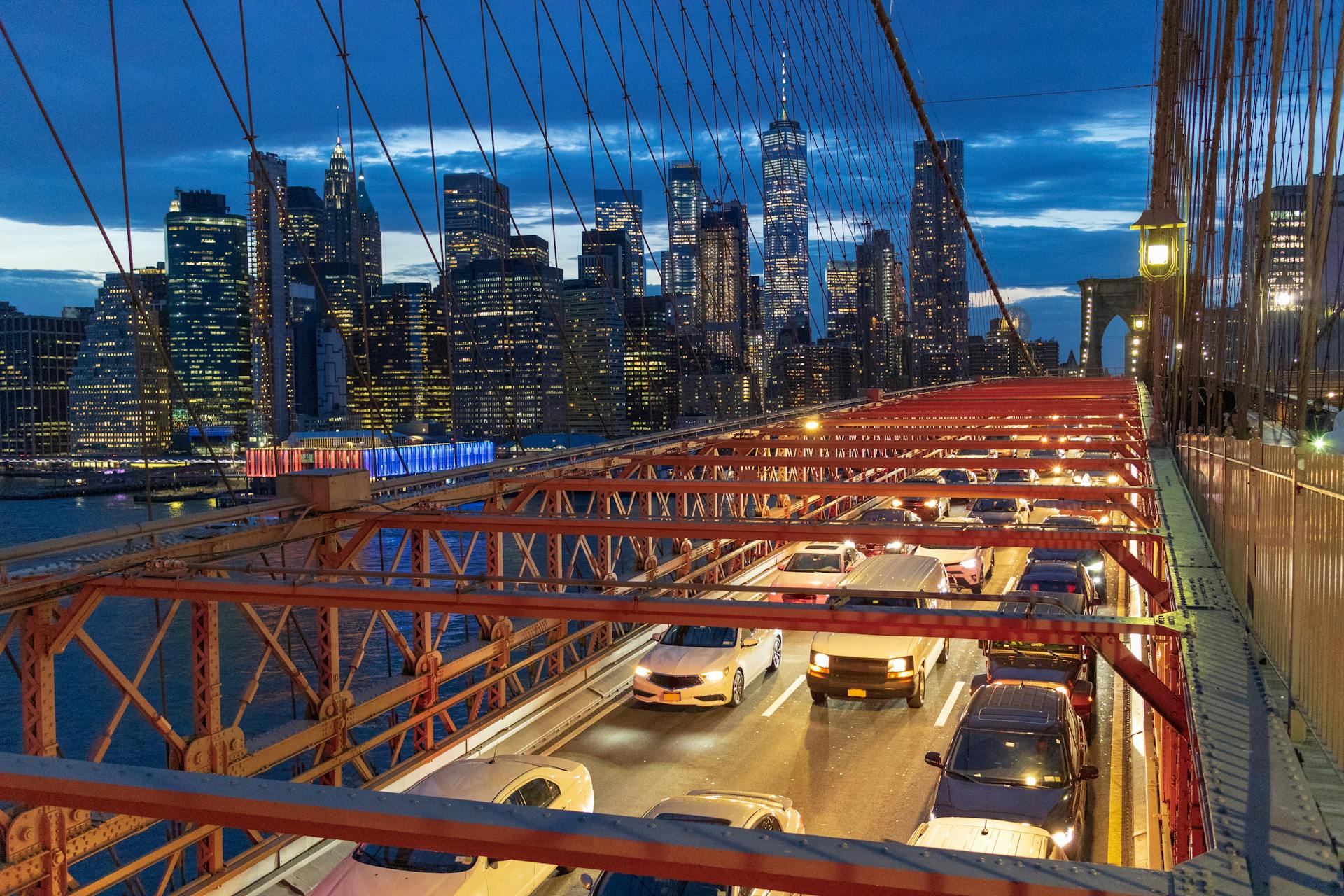 Red Metal Bridge over River during Night Time