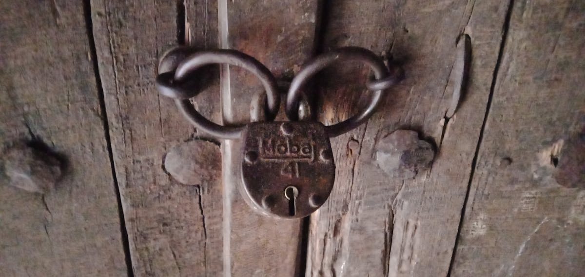 Person organizing vitamin supplements into a weekly pill organizer