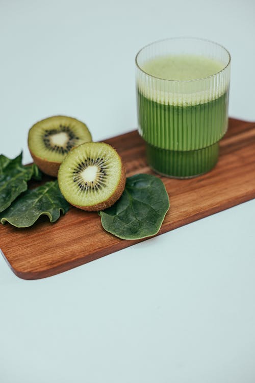 Photograph of Kiwis Beside a Smoothie