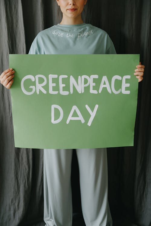 Woman Holding a Sign on Environmental Protection Concept