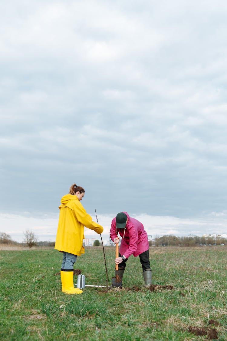 A Man Digging The Soil