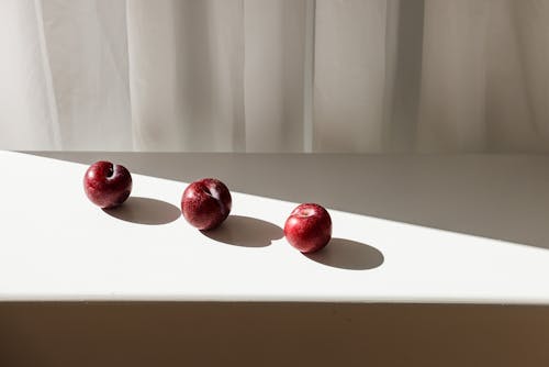 Reed Apples on White Table