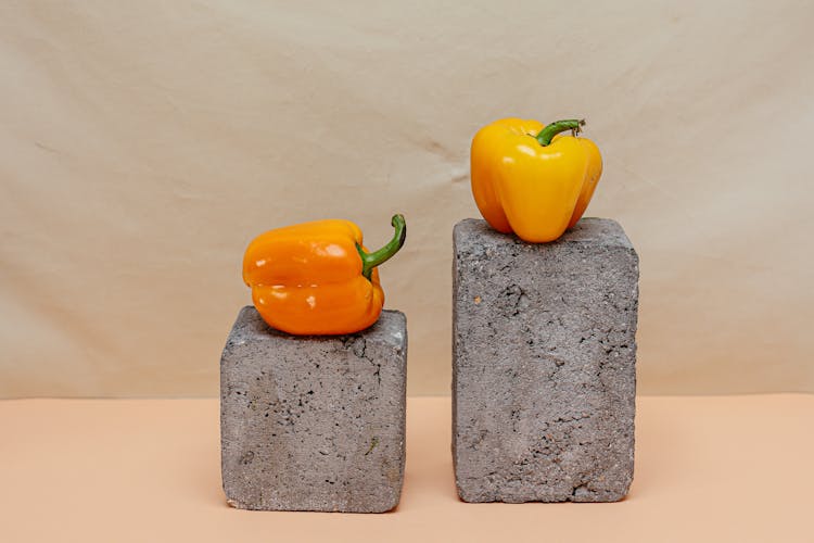 Bell Peppers On Top Of Rocks