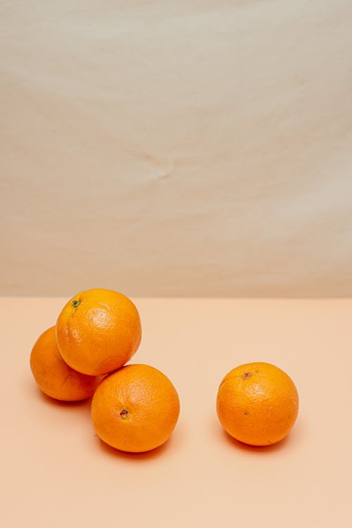 Oranges on Pink Surface