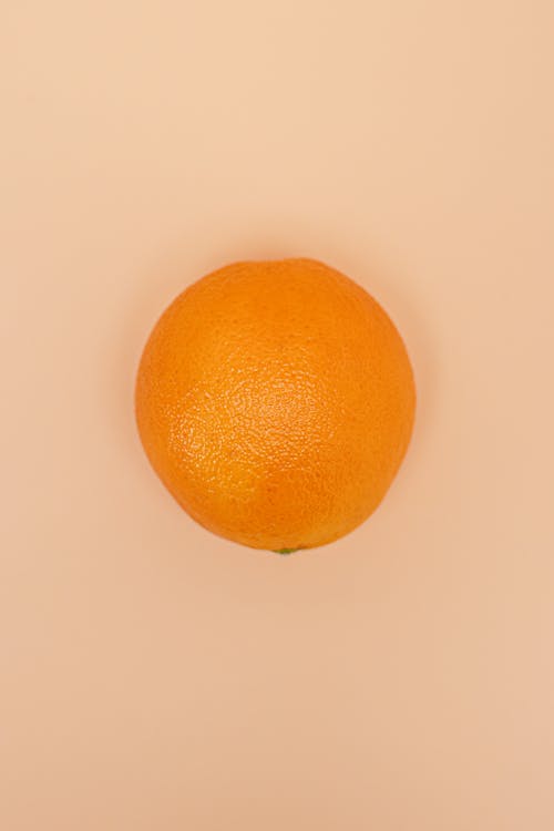 Orange on Pink Surface