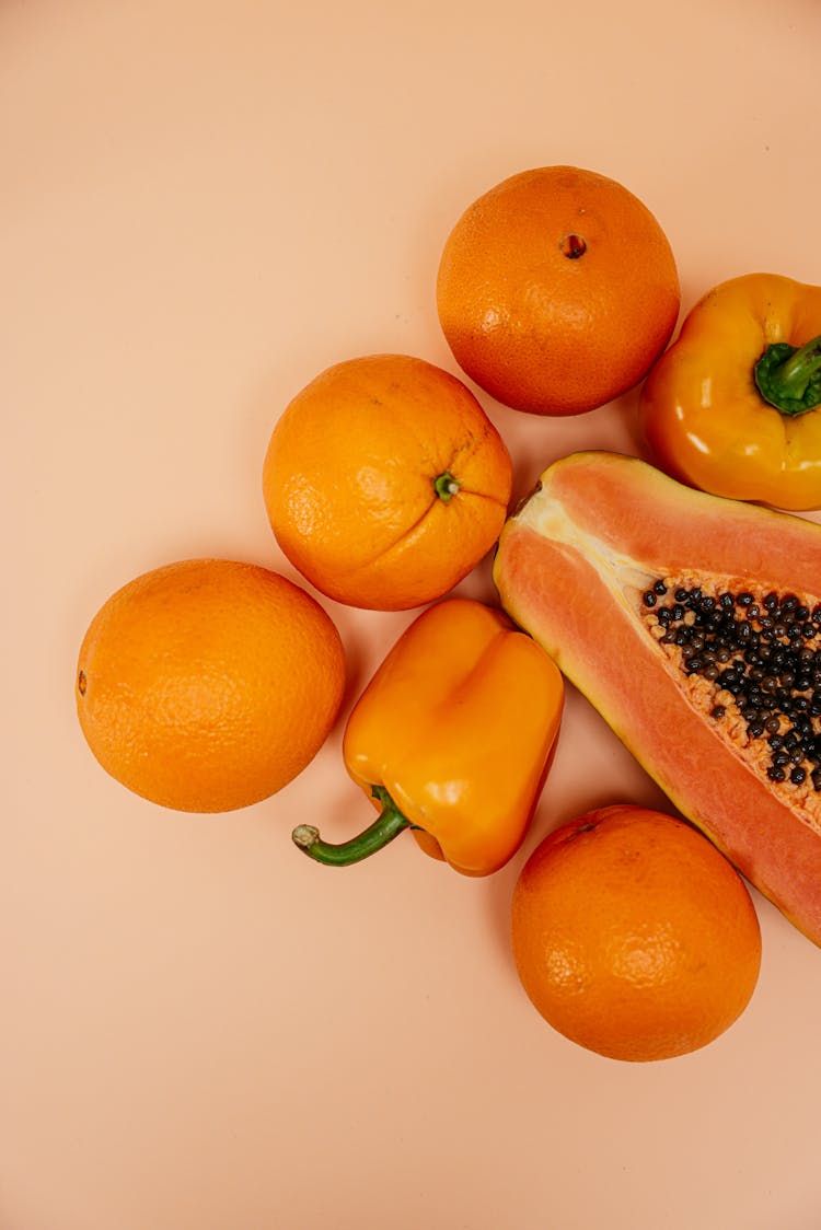 Orange Fruits Beside Sliced Papaya