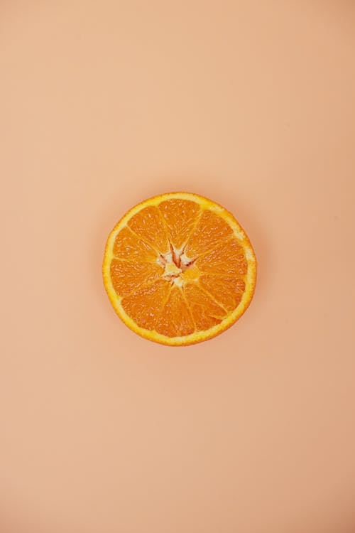 Top View of Sliced Orange Fruit on White Surface