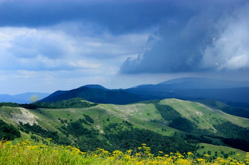 Scenic View of Mountains Under the Dark Clouds