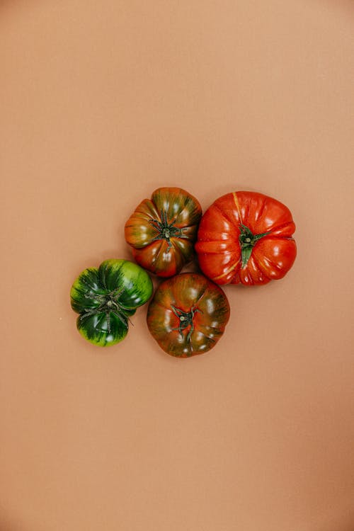 Tomatoes on Orange Surface
