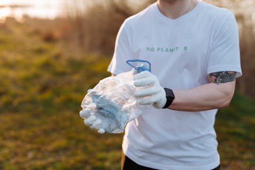 A Man Crashing a Recyclable Plastic Container