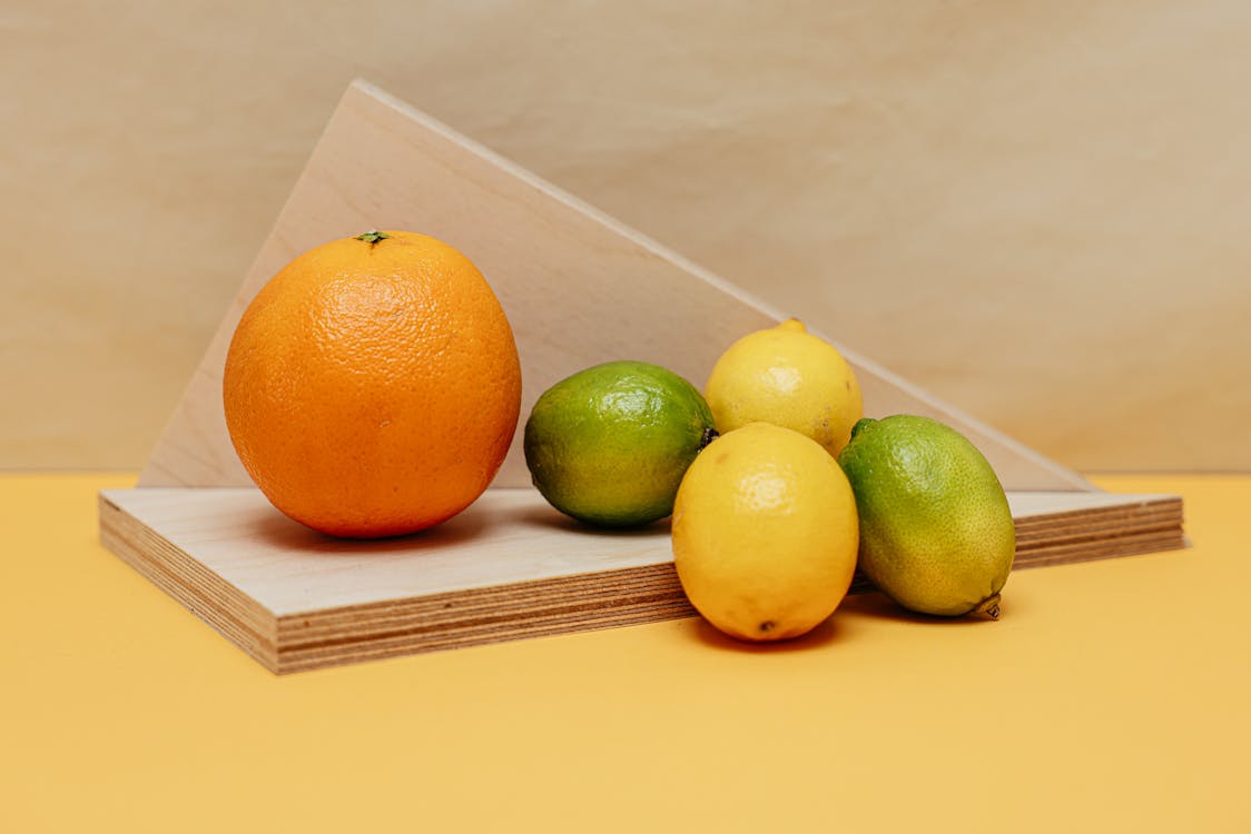 Free Citrus Fruits on Brown Wooden Plank Stock Photo