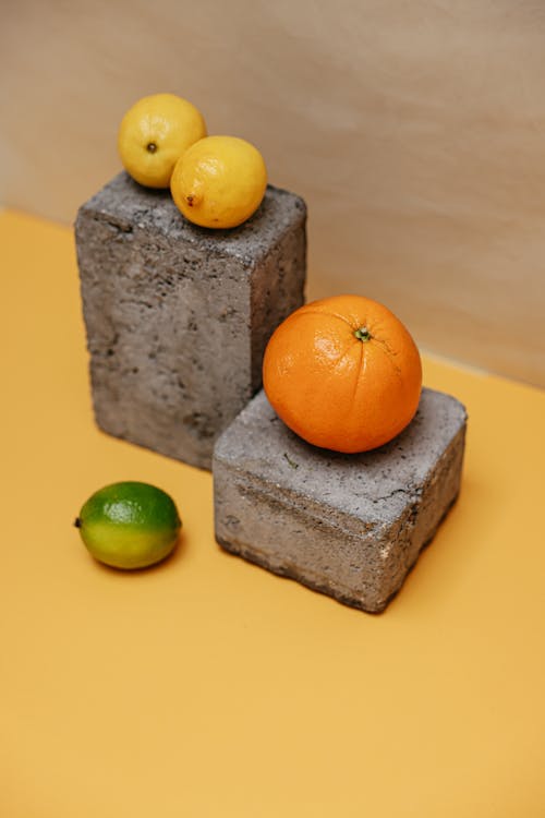 Free Orange Fruit on Gray Concrete Block Stock Photo