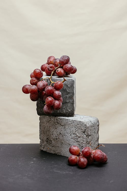 Grapes on a Gray Concrete Platform