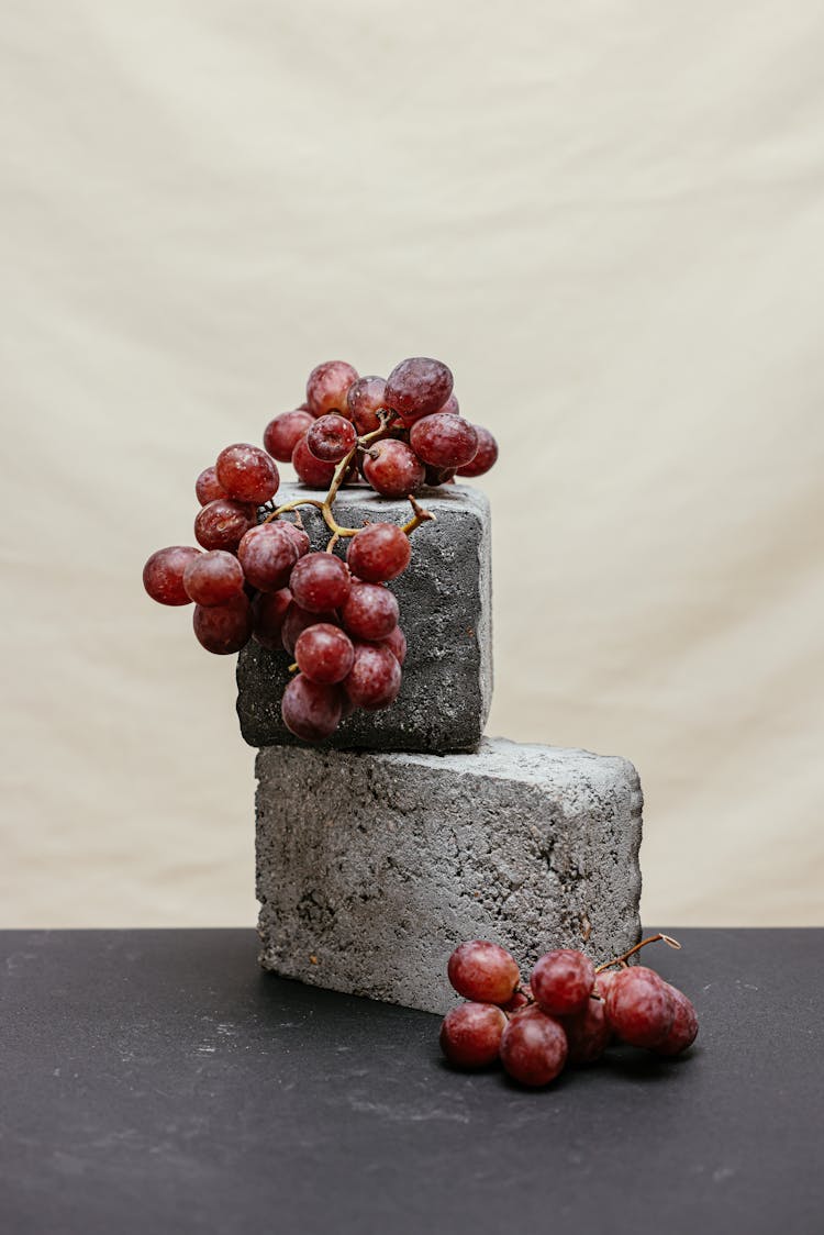 Grapes On A Gray Concrete Platform