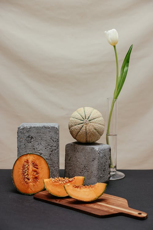 Slices of Melon on a Wooden Board