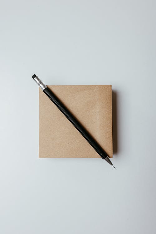 Free Close-Up Shot of a Pen on a Notepad Stock Photo